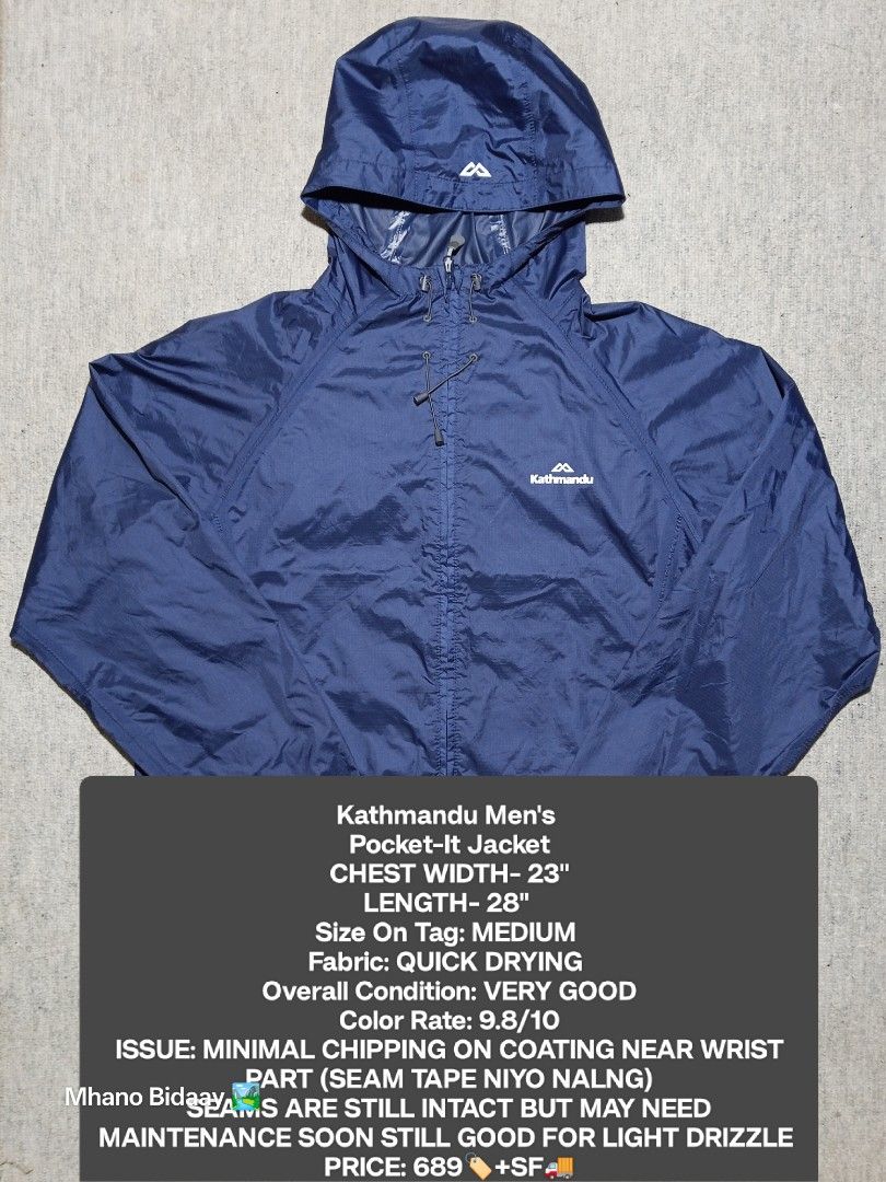Kathmandu Men's Pocket-It Jacket - Medium (Category: Coats, Jackets and Outerwear) located in Valencia. Submitted by mhano_bidaay_outdoors_218 (Listing ID 1427214921, Image 1). Description: Kathmandu Men's Pocket-It Jacket in size Medium. Features a quick-drying fabric and a hood. Chest width is 23 inches, and the length is 28 inches. The jacket is navy blue. There is minimal chipping on the coating near the wrist. The seams are still intact but 