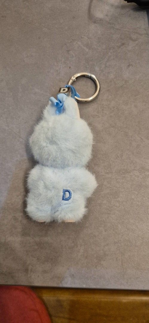 Labubu Keychain (Category: Designer & Blind Box Toys) located in Singapore. Submitted by darktrick (Listing ID 1427280607, Image 2). Description: Adorable labubu keychain features a fluffy blue plush design. It has a metal keyring and a blue ribbon detail. The plush has some wear and tear, as shown in the photos. A charming collectible!.