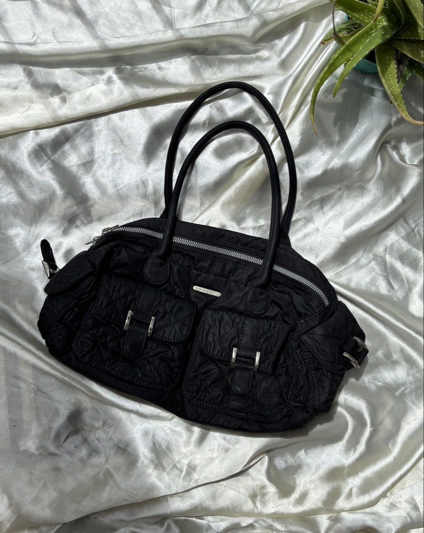 Lecaf Black Fabric Satchel Bag (Category: Shoulder Bags) located in Valenzuela. Submitted by willow.marae (Listing ID 1427183568, Image 1). Description: L: 7” W: 13” - no issues - has 3 pockets inside, 2 in front, 2 on the sides - all zippers are smoothly working - spacious and versatile - excellent condition - Our pieces are thoughtfully curated and pre-loved, each carrying its own story and character. Because they’ve lived a life before reachin