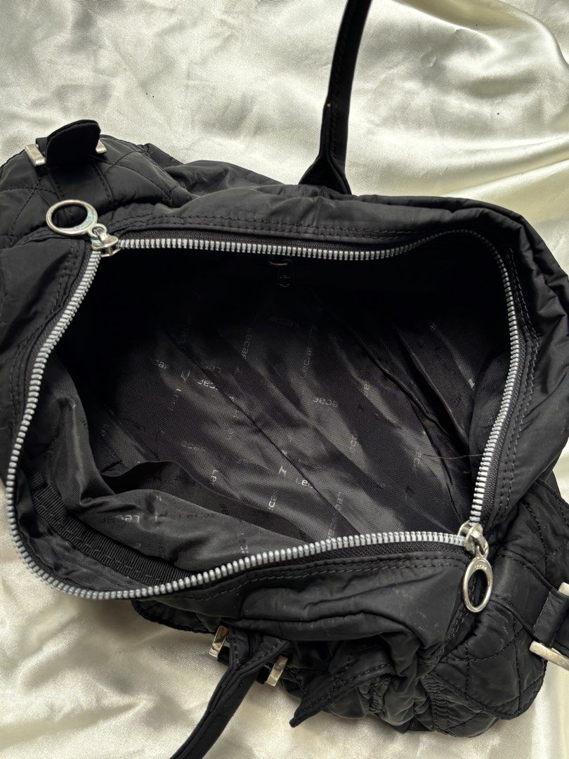 Lecaf Black Fabric Satchel Bag (Category: Shoulder Bags) located in Valenzuela. Submitted by willow.marae (Listing ID 1427183568, Image 3). Description: L: 7” W: 13” - no issues - has 3 pockets inside, 2 in front, 2 on the sides - all zippers are smoothly working - spacious and versatile - excellent condition - Our pieces are thoughtfully curated and pre-loved, each carrying its own story and character. Because they’ve lived a life before reachin
