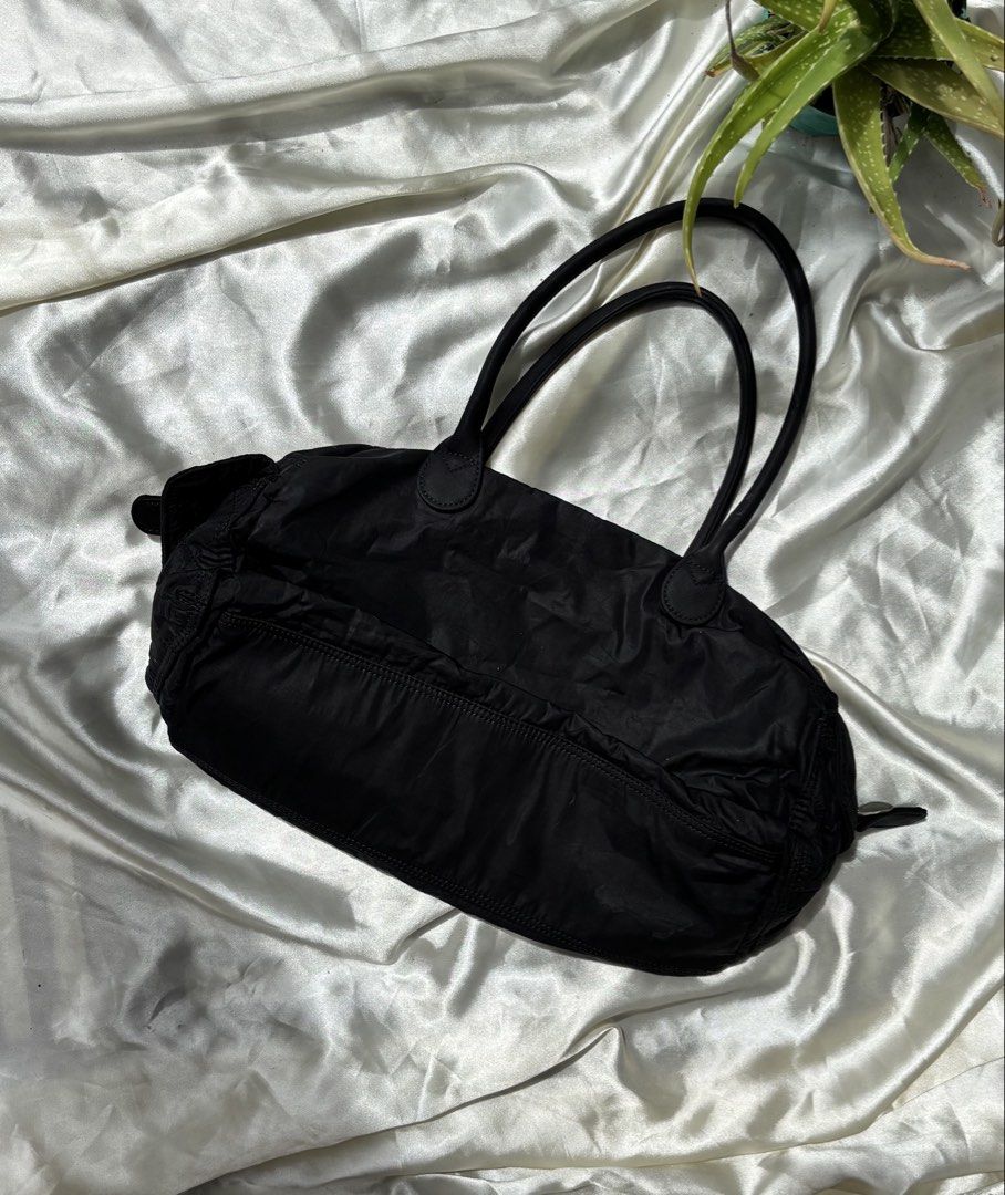 Lecaf Black Fabric Satchel Bag (Category: Shoulder Bags) located in Valenzuela. Submitted by willow.marae (Listing ID 1427183568, Image 2). Description: L: 7” W: 13” - no issues - has 3 pockets inside, 2 in front, 2 on the sides - all zippers are smoothly working - spacious and versatile - excellent condition - Our pieces are thoughtfully curated and pre-loved, each carrying its own story and character. Because they’ve lived a life before reachin