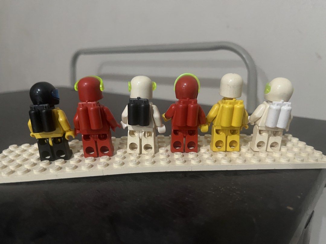 Lego Classic Space Minifigures (Category: Lego & Building Sets) located in Pasay City. Submitted by beye01 (Listing ID 1427174410, Image 3). Description: Set of Lego Classic Space minifigures. Includes six minifigures with various colored helmets and air tanks. Each minifigure has the Classic Space logo on the torso. These are well used. WYSIWYG. 300 ea except those with issues: White (3rd from right - small crack on arm and loose head) - 250 Red