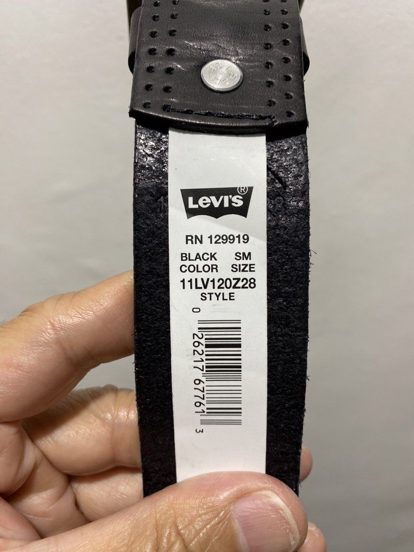Levi's Black Leather Belt (Category: Belts) located in Cagayan de Oro. Submitted by cu_2022 (Listing ID 1427299597, Image 2). Description: Genuine Levi's black leather belt. Features a silver buckle and a perforated design. The size is SM, fitting waist sizes 30-32. The belt has the Levi's logo embossed on the leather. The style code is 11LV120Z28. Made of leather..