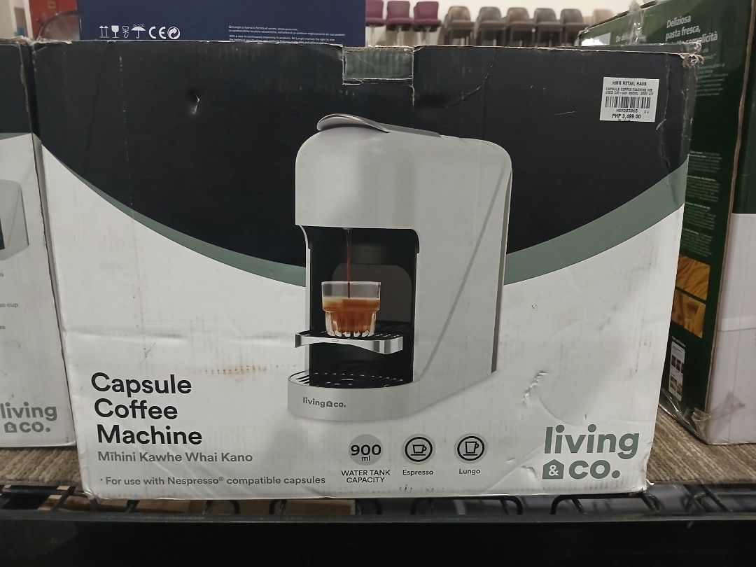 Living & Co Capsule Coffee Machine (Category: Coffee Machines & Makers) located in Manila. Submitted by sc_arvin (Listing ID 1427241455, Image 1). Description: Living & Co capsule coffee machine. It has a 900ml water tank capacity and is compatible with Nespresso capsules. It features espresso and lungo settings. The machine is white and comes in its original box..