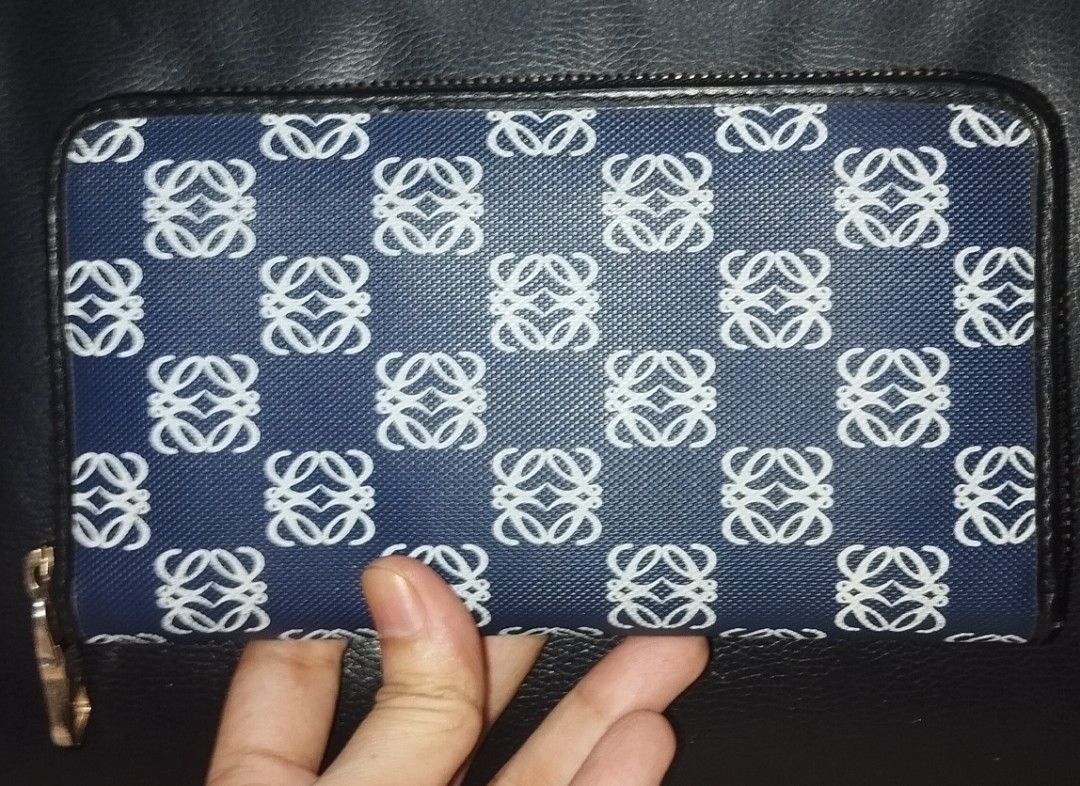 Loewe Anagram Zip Around Long Wallet (Category: Luxury Bags & Wallets) located in Taguig. Submitted by belle25cabano (Listing ID 1427239135, Image 2). Description: Loewe Anagram Zip Around Long Wallet made in China, Searchable code, lampo zipper nothing to declare, lightly used Lang talaga si wallet smooth zipper no rips and tears, no crack no bakbak on leather 10/10 pa ang PVC print and color, no bubbles no rubs sign of usage only ready to use, 