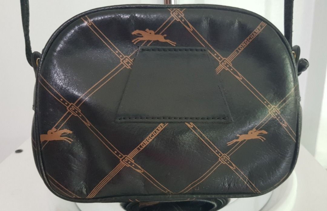 Longchamp Leather Crossbody Pouch (Category: Luxury Bags & Wallets) located in Los Banos. Submitted by mommybabyshopper (Listing ID 1427226695, Image 3). Description: • Authentic vintage Longchamp crossbody pouch in leather. • Pouch only, no box/paper bag/dustbag • Has a belt loop so can be worn as waist/beltbag • Some tarnishing sa hardware (zipper pull).