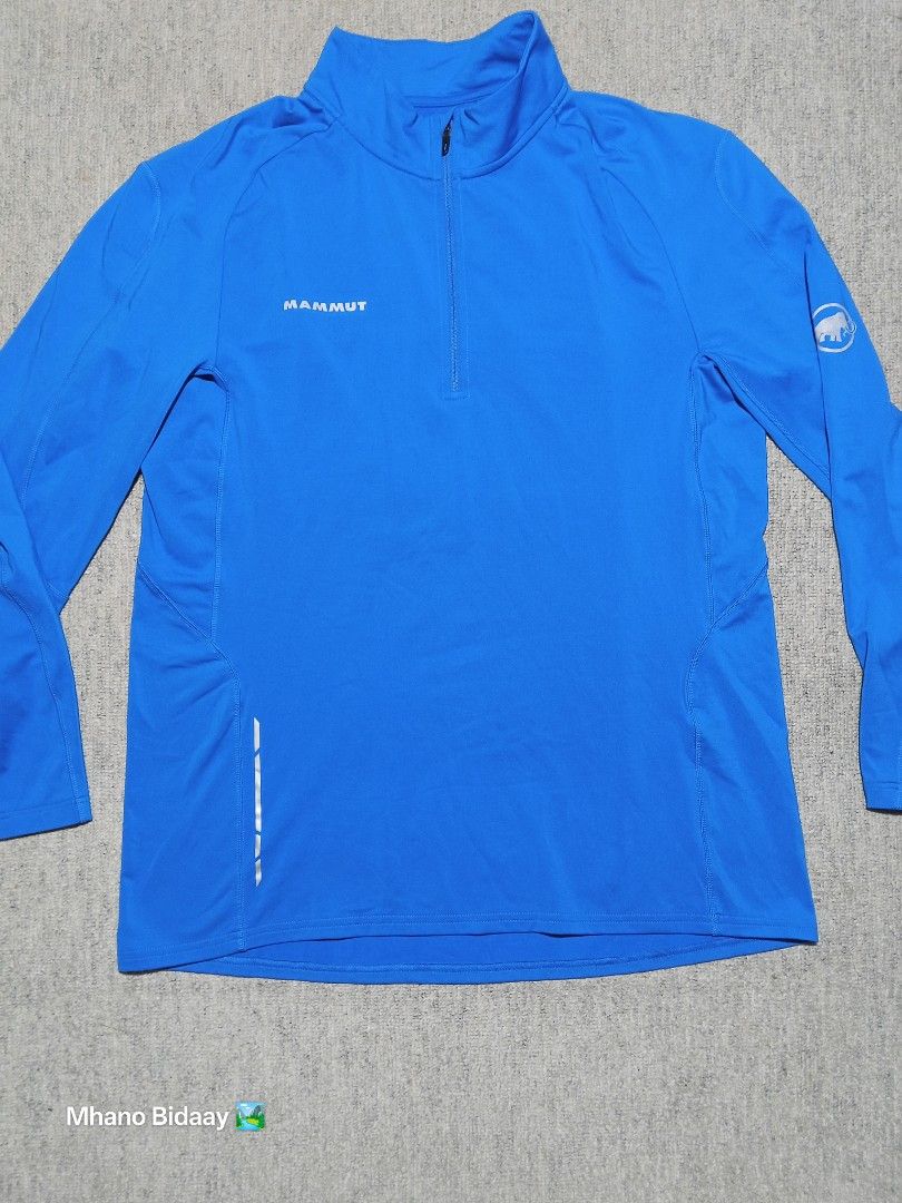 Mammut Men's Active Half-Zip Trail L/S (Category: Coats, Jackets and Outerwear) located in Valencia. Submitted by mhano_bidaay_outdoors_218 (Listing ID 1427223747, Image 2). Description: Mammut Men's Active Half-Zip Trail L/S jacket. Features a quick-drying fabric. Chest width is 21 inches, and the length is 26.5 inches. The sleeve length has been altered. Color rate is 9.8/10. Size on tag is EXTRA LARGE..