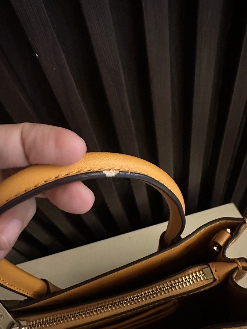 Michael Kors Mercer Small Top-Handle Bag (Category: Luxury Bags & Wallets) located in Manila. Submitted by lucky.macherie (Listing ID 1427238355, Image 3). Description: Michael Kors Mercer bag features a top handle and a detachable shoulder strap. Mustard yellow color Issues: Minimal rubs on piping (strap and handle) In very good condition, ang ganda ng leather, very vibrant color, hardware gold na gold pa with no tarnishing.