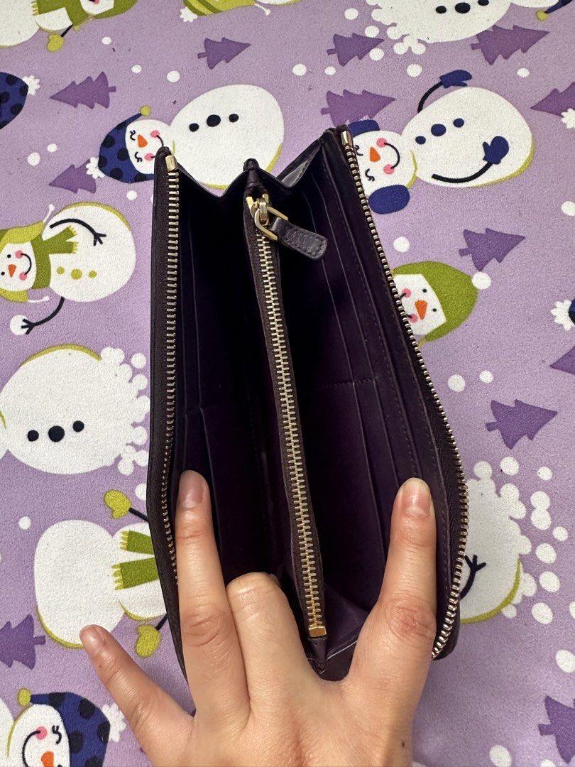 Miu Miu Purple Zip Around Wallet (Category: Luxury Bags & Wallets) located in Baliuag. Submitted by katebartolo12 (Listing ID 1427214114, Image 3). Description: Please look at the picture closely for the condition of the wallet..