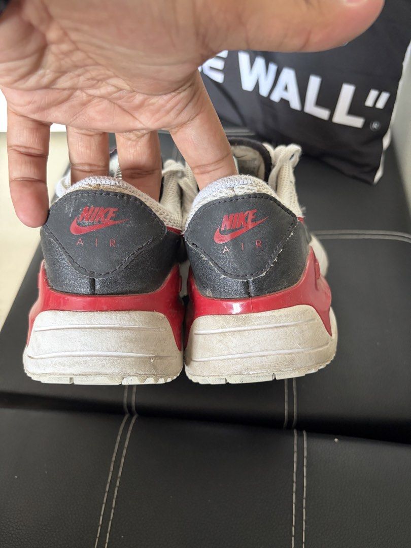 Nike Air Max 1 Sneakers (Category: Sneakers) located in Bulacan. Submitted by kellinquinn (Listing ID 1427237775, Image 2). Description: - Nike Air Max 1 sneakers - Color: White, red, and black - Size: US 5Y - Features Nike Air logo - Visible mesh material - White laces - Signs of wear on soles and uppers.