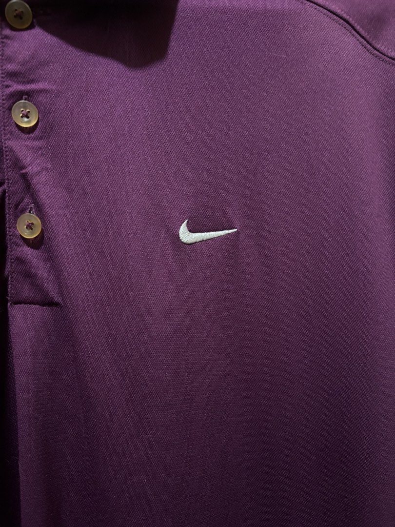 Nike Golf Purple Polo Shirt (Category: Tshirts & Polo Shirts ) located in Manila. Submitted by aj-thrifter (Listing ID 1427308507, Image 3). Description: Nike Golf polo shirt is a vibrant purple color. It features a classic polo collar with three buttons and the Nike logo on the chest. The size is XL. dimension: 24/31.5.