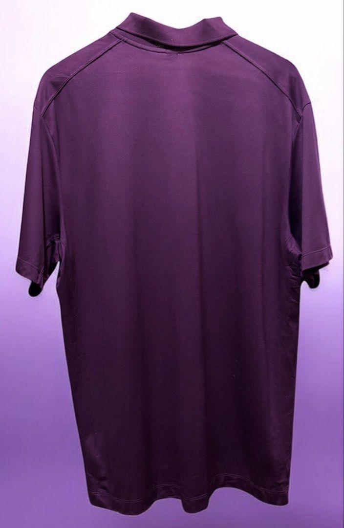 Nike Golf Purple Polo Shirt (Category: Tshirts & Polo Shirts ) located in Manila. Submitted by aj-thrifter (Listing ID 1427308507, Image 2). Description: Nike Golf polo shirt is a vibrant purple color. It features a classic polo collar with three buttons and the Nike logo on the chest. The size is XL. dimension: 24/31.5.