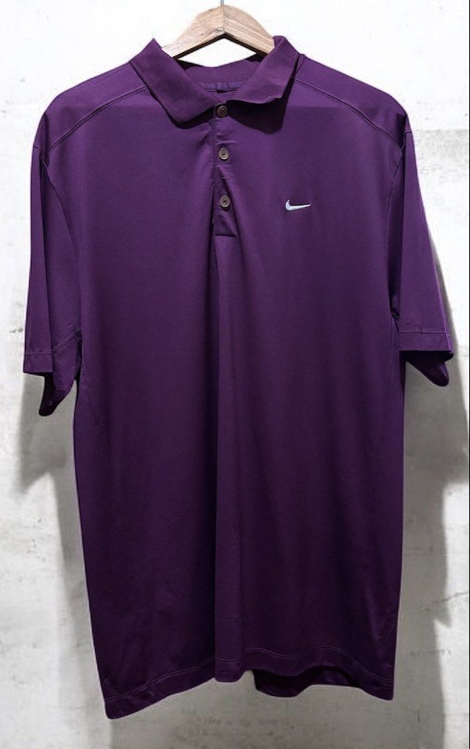 Nike Golf Purple Polo Shirt (Category: Tshirts & Polo Shirts ) located in Manila. Submitted by aj-thrifter (Listing ID 1427308507, Image 1). Description: Nike Golf polo shirt is a vibrant purple color. It features a classic polo collar with three buttons and the Nike logo on the chest. The size is XL. dimension: 24/31.5.