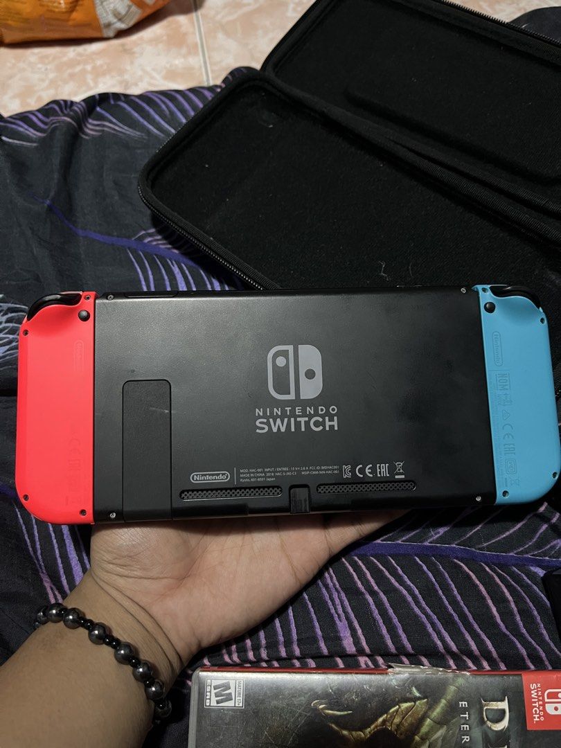 Nintendo switch bundle v2 (Category: Nintendo) located in Valenzuela. Submitted by zyruz_navs (Listing ID 1427283132, Image 2). Description: FOR SALE: Nintendo Switch V2 Bundle 🎮 ✅ Good condition, smooth performance ✅ Complete accessories: • Dock • Charger • HDMI • Joy-Cons + 2 player straps 🎒 With FREE Hard Case 🎮 Includes 3 games: • Xenoblade Chronicles 2 • Jump Force • Diablo III ⚠️ Issue: Right Joy-Con works perfectly when attached, but ha
