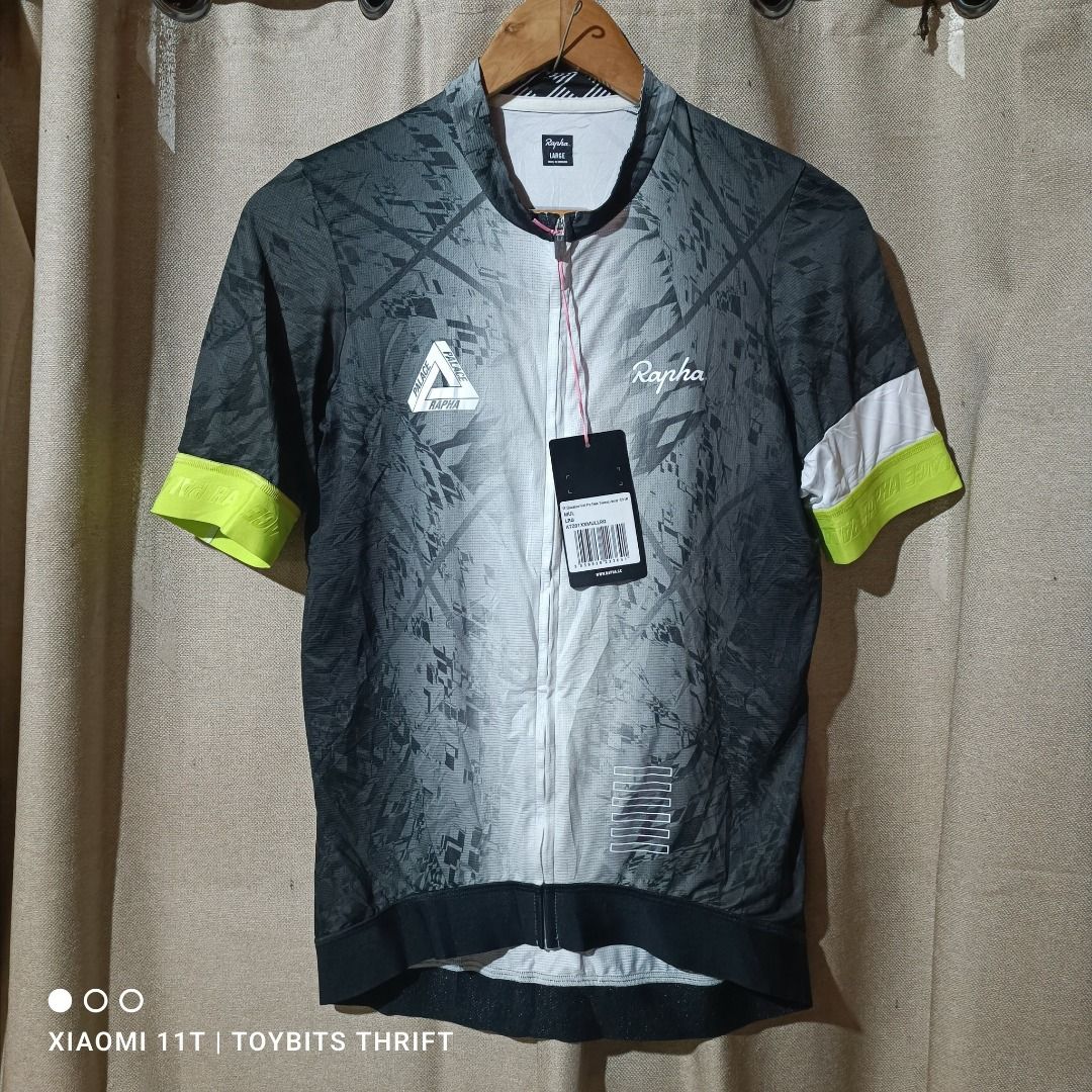 Rapha EF Education First Pro Team Training Jersey - LRG (Category: Activewear) located in Davao. Submitted by victorcalit (Listing ID 1427275515, Image 1). Description: Rapha Pro Team Training Jersey in size Large. Features a Palace design. Made with 87% polyester and 13% elastane. Includes care instructions. Made in Romania. The jersey has a full zip and a unique design on the back with the Palace and Rapha logos..