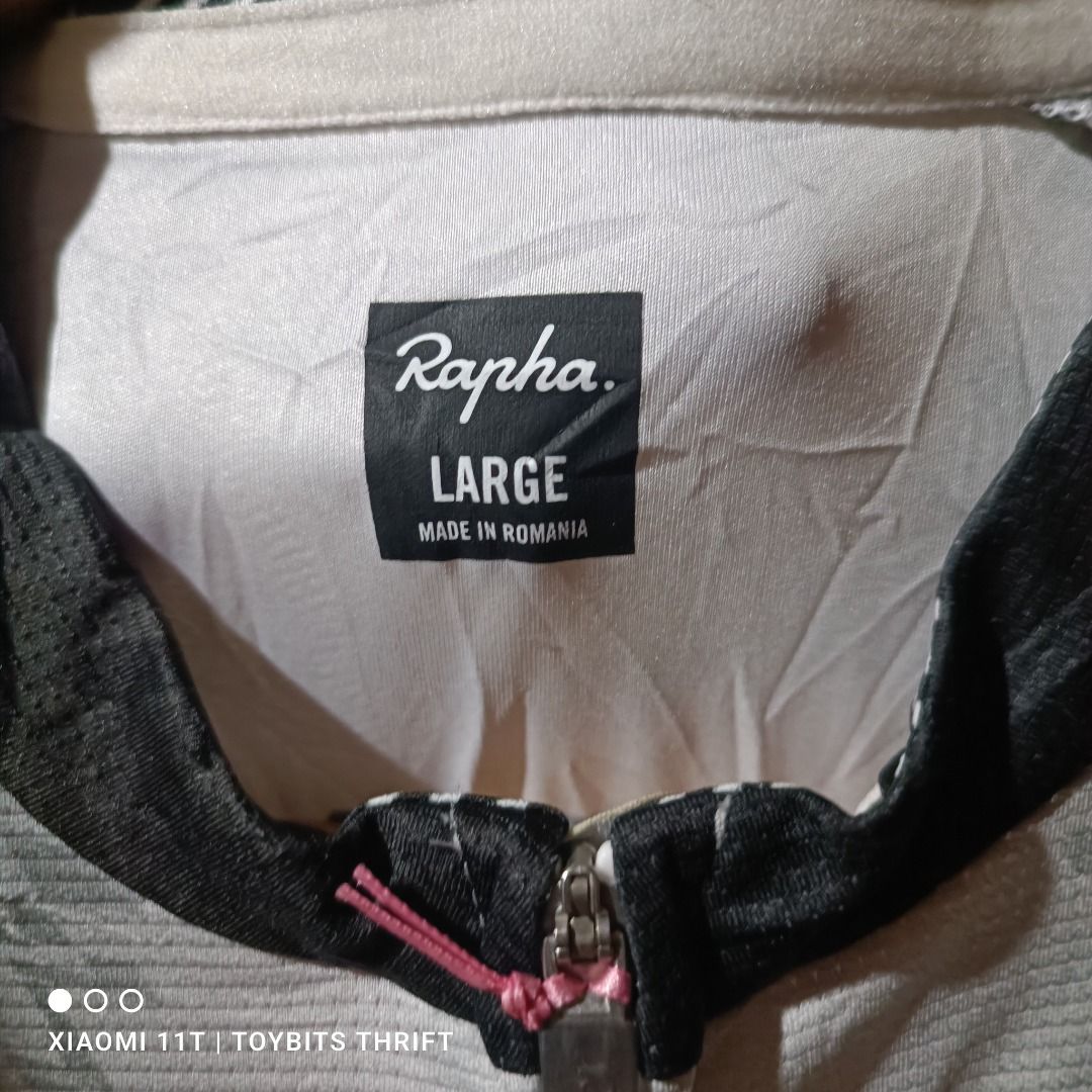 Rapha EF Education First Pro Team Training Jersey - LRG (Category: Activewear) located in Davao. Submitted by victorcalit (Listing ID 1427275515, Image 3). Description: Rapha Pro Team Training Jersey in size Large. Features a Palace design. Made with 87% polyester and 13% elastane. Includes care instructions. Made in Romania. The jersey has a full zip and a unique design on the back with the Palace and Rapha logos..