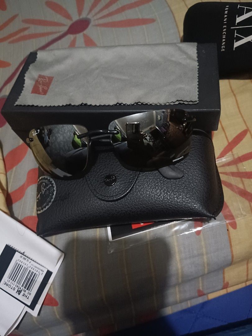 Ray-Ban Sunglasses RB4255 (Category: Sunglasses & Eyewear) located in Caloocan City. Submitted by jee2727 (Listing ID 1427273648, Image 2). Description: Authentic Ray-Ban sunglasses. Features a sleek black frame and tinted lenses. Comes with the original case, cleaning cloth, and box. The model number is RB4255, and the size is 601/5J 60015 135 3P. Includes all original packaging and accessories..
