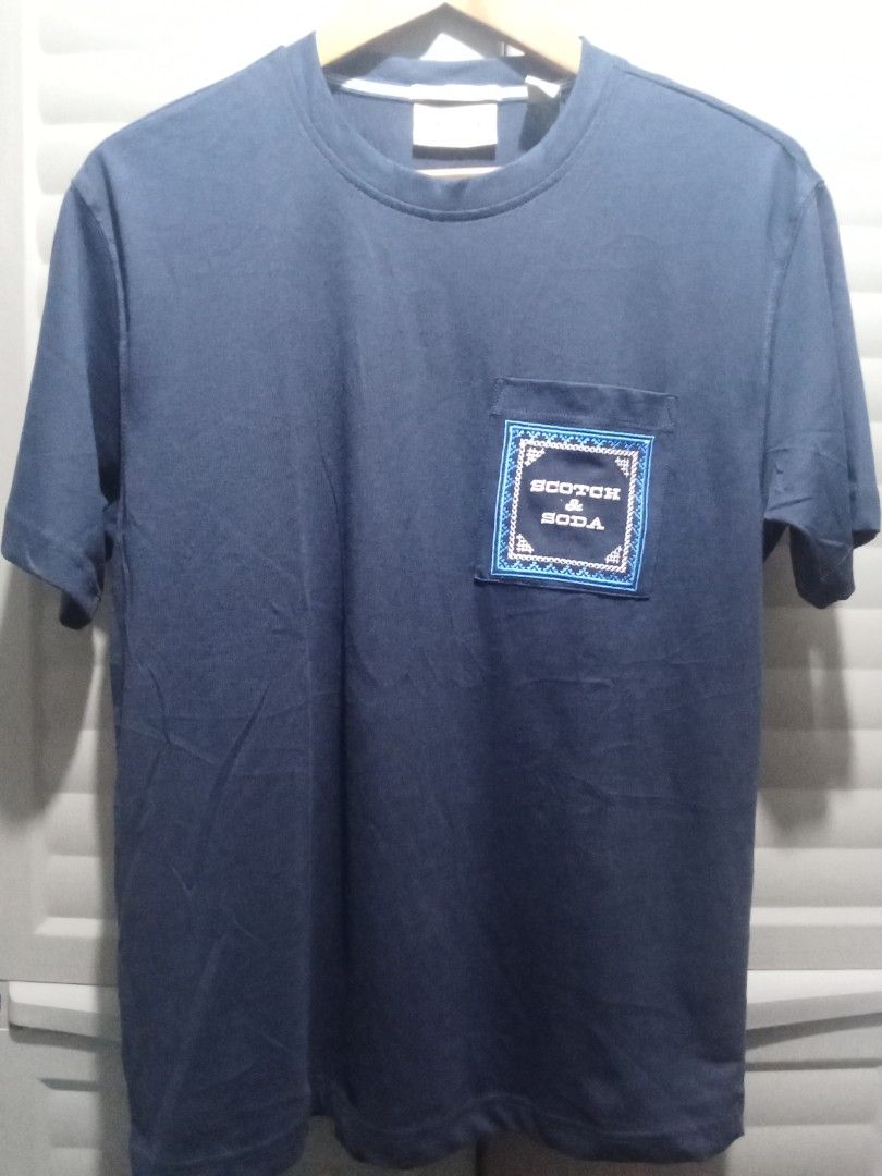 Scotch & Soda Graphic T-shirts (Category: Tshirts & Polo Shirts ) located in Makati City. Submitted by kuysman (Listing ID 1427174382, Image 3). Description: Scotch & Soda T-shirts are available. One is navy blue with a building graphic (21.5 x 28" S on tag) , another is beige with a pocket design (23 x 27.5" M on tag), aqua blue with a floral pocket design(24 x 29" L on tag) and the last navy blue pocket design (20.5 x 25" S on tag). All have sh