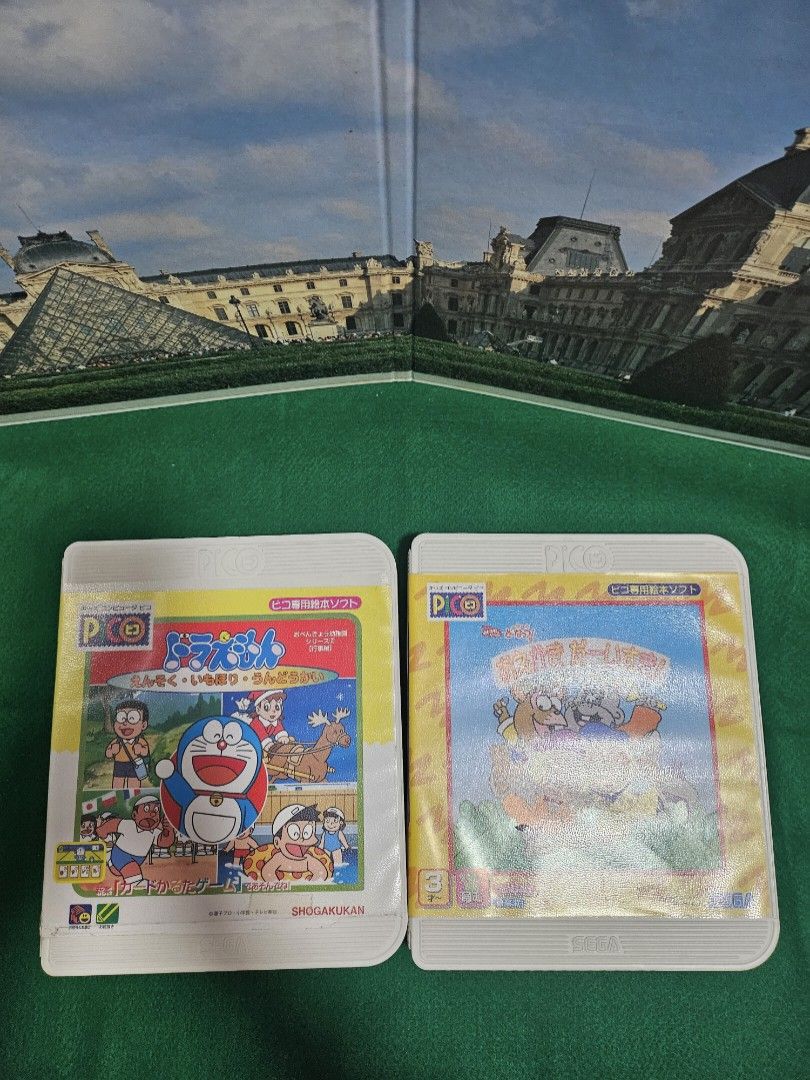 Sega Pico Doraemon & Doremifa Video Game Cartridges (Category: Nintendo) located in Quezon City. Submitted by lamoure_demavie (Listing ID 1427228654, Image 1). Description: WYSIWYG -Preloved -signs of use -circa 1997 -as is/ untested(no console) -collectible -FIRM PRICE.