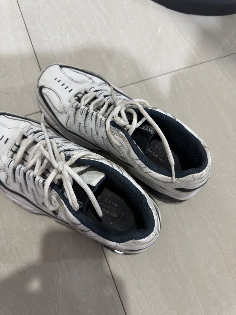 Skechers Wide Fit Sneakers (Category: Sneakers) located in Manila. Submitted by randomdeclutter (Listing ID 1427272421, Image 3). Description: White Skechers sneakers with black accents. Features a lace-up closure. The shoes have a wide fit design. Dirt marks. Get it cleaned and it will look brand new .