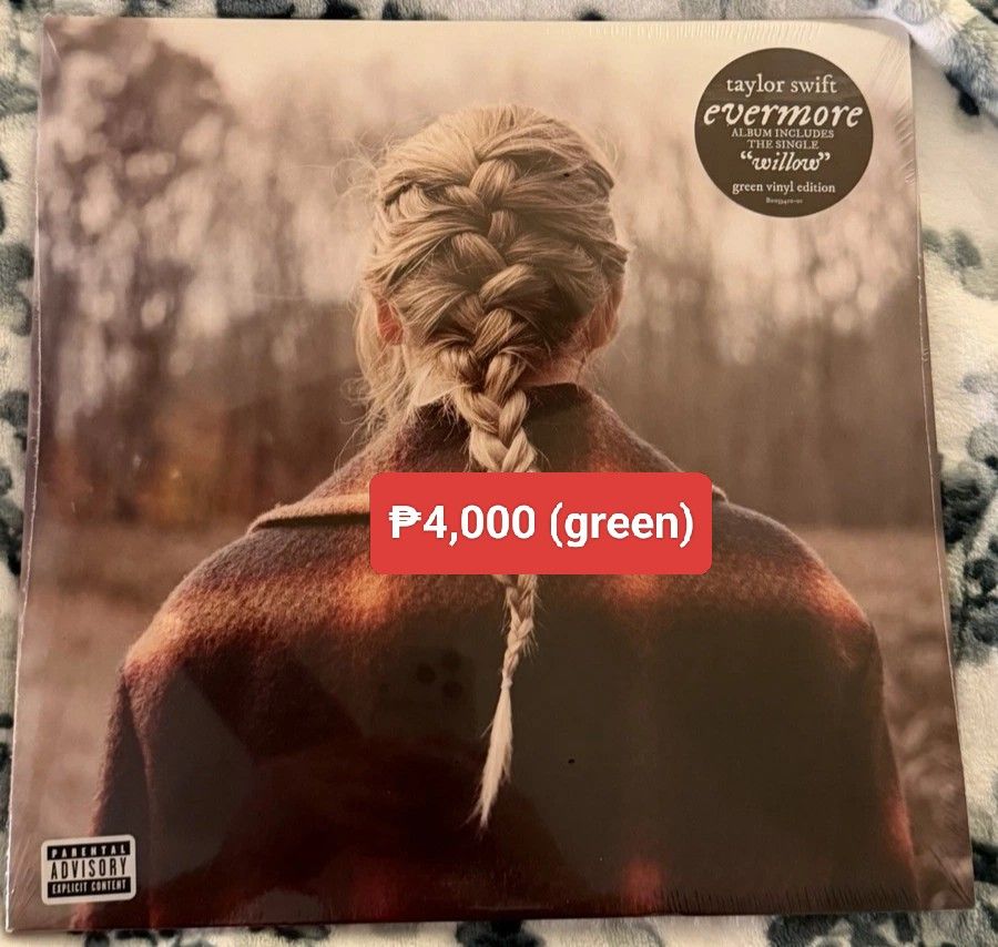 Taylor Swift - Evermore Green Colored Vinyl (Category: Vinyls) located in Manila. Submitted by jhenaloymerchandise (Listing ID 1427302686, Image 1). Description: Taylor Swift - Evermore Green Colored Vinyl ₱4,000 Brand New sealed .
