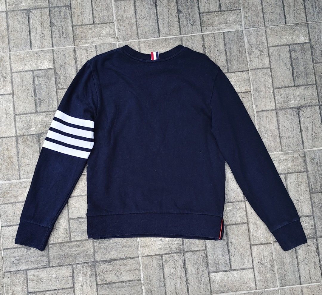 Thom Browne Navy Sweatshirt with White Stripes (Category: Luxury Apparel) located in Santiago. Submitted by jelkompany2023 (Listing ID 1427170155, Image 2). Description: small to medium. Excellent condition. Authenticity Guaranteed MADE IN JAPAN.