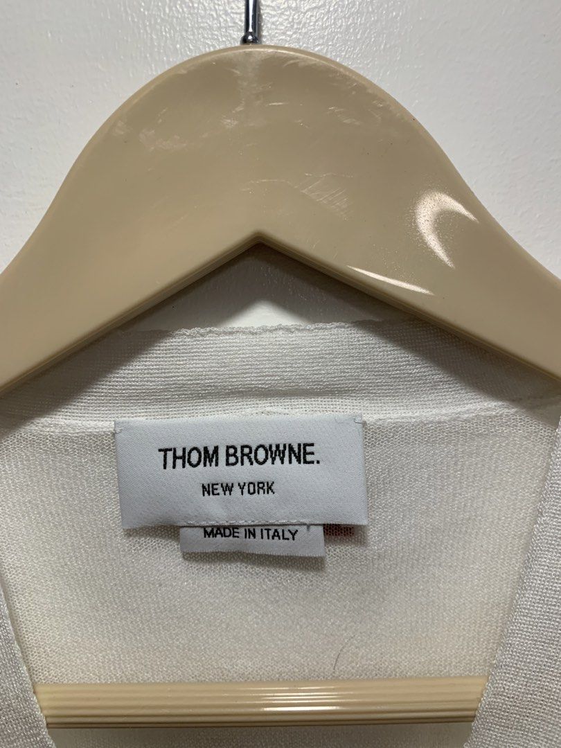 Thom Browne "White" 4-Bar Silk Cardigan (Category: Luxury Apparel) located in Bacolod City. Submitted by moboandmoga (Listing ID 1427211227, Image 3). Description: Thom Browne "White" 4-Bar Silk Cardigan Size: 36 Excellent Condition! (Sizing info) Width: 19 inches Length: 19.6" White cardigan from Thom Browne. Features a V-neck, button closure, and the brand's signature stripe detail on the left sleeve. Made in Italy. Size 36..