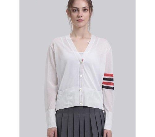Thom Browne "White" 4-Bar Silk Cardigan (Category: Luxury Apparel) located in Bacolod City. Submitted by moboandmoga (Listing ID 1427211227, Image 2). Description: Thom Browne "White" 4-Bar Silk Cardigan Size: 36 Excellent Condition! (Sizing info) Width: 19 inches Length: 19.6" White cardigan from Thom Browne. Features a V-neck, button closure, and the brand's signature stripe detail on the left sleeve. Made in Italy. Size 36..
