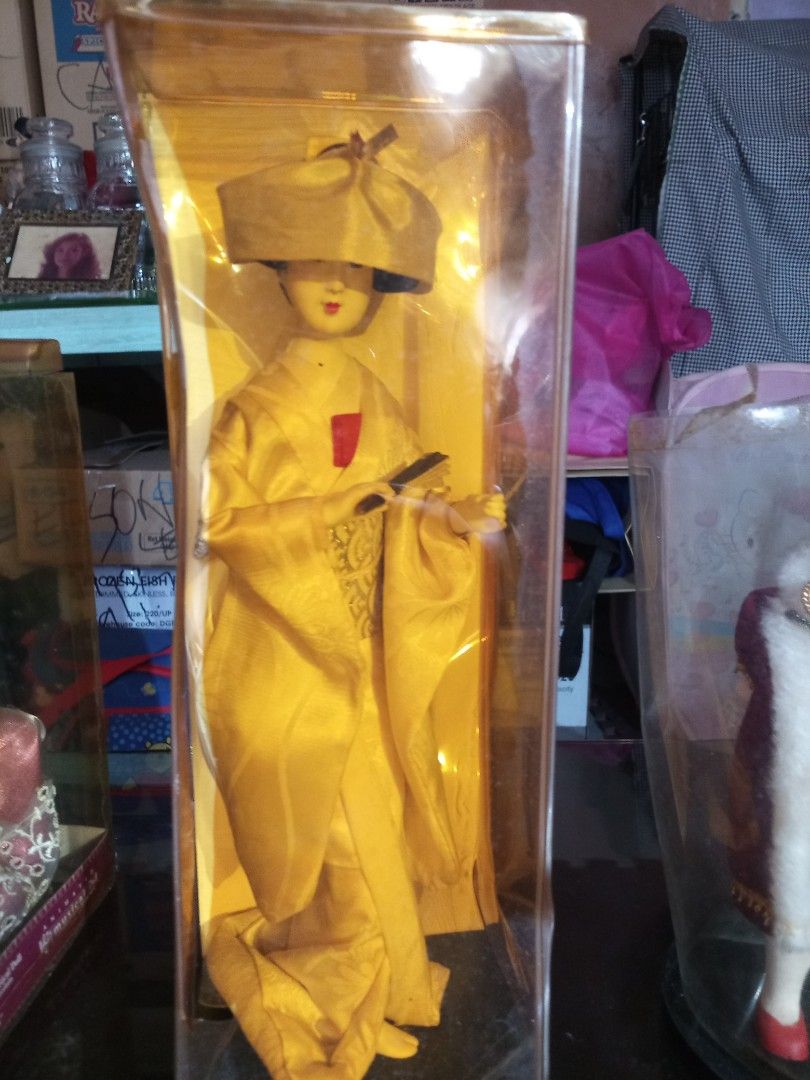 Vintage Assorted Dolls in Gift Gallery Doll in Boxes (Category: Vintage Collectibles) located in Marikina City. Submitted by picker_seller17 (Listing ID 1427206506, Image 3). Description: Collectible doll in a clear display case. The doll is wearing a red and gold dress with a matching bow. It has black hair and is holding a rose. The box has the Gift Gallery logo. The doll is in a clear plastic case..