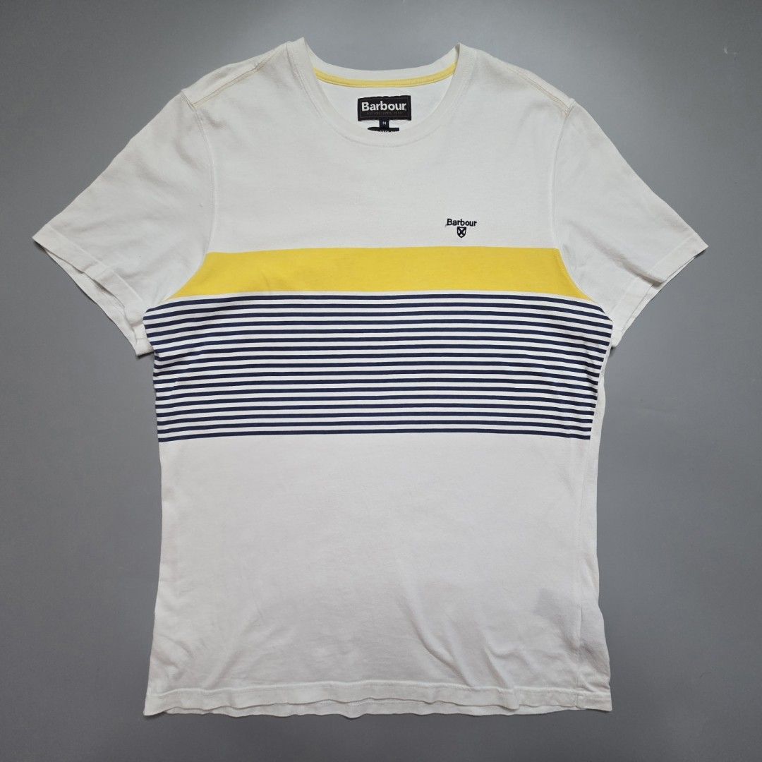 Barbour - Braeside Striped T-Shirt (Category: Tshirts & Polo Shirts ) located in Malabon City. Submitted by buynflex (Listing ID 1427470054, Image 1). Description: Braeside Striped Graphic T-Shirt Size M Dimes: W 20 x L 28 Used Good Condition Product Features Short sleeve Tailored fit Printed stripes to the front of the t-shirt Solid colour back Contrast Barbour and Shield embroidery to left chest 100% cotton 160gm Machine washable.