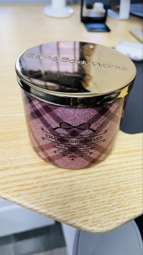 Bath & Body Works Champagne Toast Candle (Category: Home Fragrance) located in Tagaytay City. Submitted by lengleng13 (Listing ID 1427480700, Image 3). Description: Champagne toast 1/4 missing wax 3 wicked candle Bought in Bath and body works online Rfs: Declutter stuff.