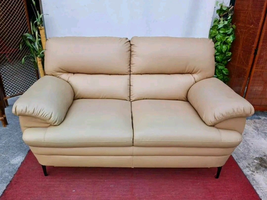 Beige 2-Seater Sofa (Category: Sofas) located in Valenzuela. Submitted by princeraya55649 (Listing ID 1427400559, Image 2). Description: 2-Seater Leather Sofa 63”L x 35”W x 19”SH Php 9,900.