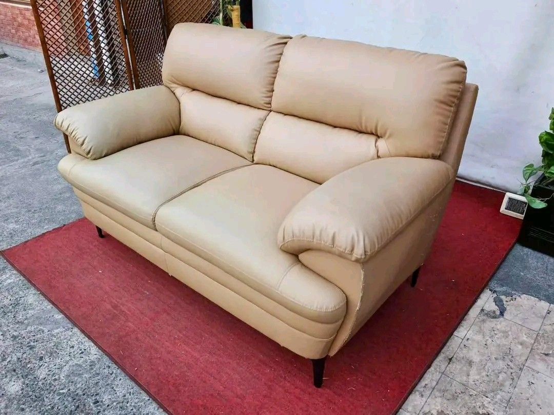 Beige 2-Seater Sofa (Category: Sofas) located in Valenzuela. Submitted by princeraya55649 (Listing ID 1427400559, Image 3). Description: 2-Seater Leather Sofa 63”L x 35”W x 19”SH Php 9,900.