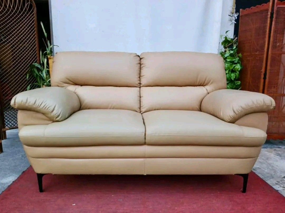 Beige 2-Seater Sofa (Category: Sofas) located in Valenzuela. Submitted by princeraya55649 (Listing ID 1427400559, Image 1). Description: 2-Seater Leather Sofa 63”L x 35”W x 19”SH Php 9,900.