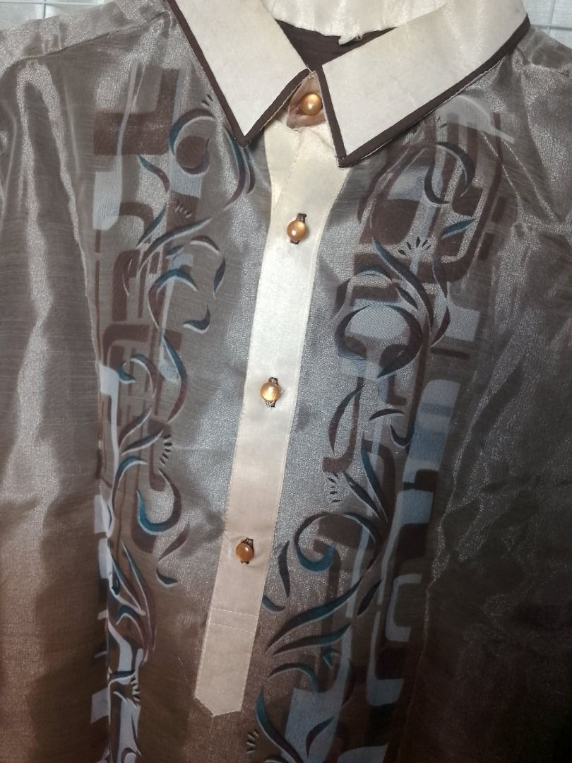 Brown Barong Tagalog printed designs for men (Category: Formal Shirts) located in Pasig City. Submitted by symone8 (Listing ID 1427374967, Image 3). Description: Color: Gradient brown color Designs: Gradient style colored barong / printed not embroidered Fabric: Smooth, synthetic fabric, silk like, lightweight material Measurements: Width - 22" chest, / Height - 29" length.