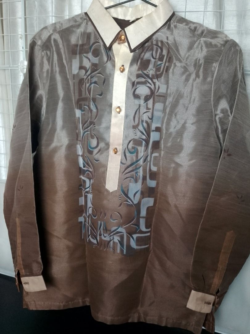 Brown Barong Tagalog printed designs for men (Category: Formal Shirts) located in Pasig City. Submitted by symone8 (Listing ID 1427374967, Image 1). Description: Color: Gradient brown color Designs: Gradient style colored barong / printed not embroidered Fabric: Smooth, synthetic fabric, silk like, lightweight material Measurements: Width - 22" chest, / Height - 29" length.