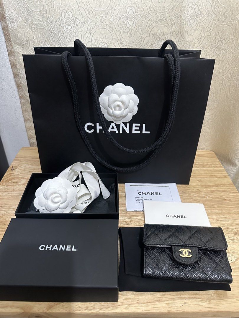 Chanel Classic Flap Card Holder (Category: Luxury Bags & Wallets) located in Cebu City. Submitted by cebucitybased (Listing ID 1427391089, Image 1). Description: Chanel Flap card holder Black caviar with gold hardware Comes complete Includes original box, dust bag, copy of receipt, chanel paper bag Flaw: Stained Ribbon (Last Pic) Bought from a reputable IG seller Stylish and compact RFS: Too small for my daily use I want a bigger wallet. I will s