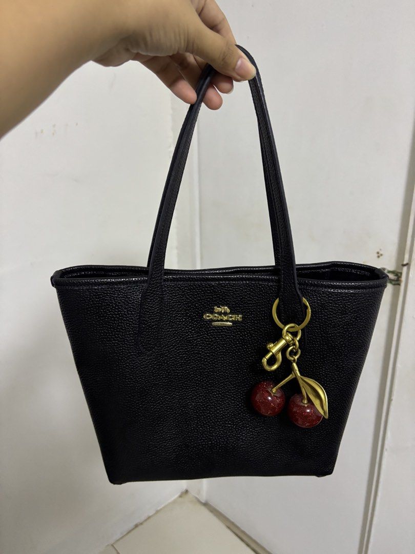 Coach Black Tote Bag with Cherry Charm (Category: Luxury Bags & Wallets) located in Pasig City. Submitted by pinkbarbiexx (Listing ID 1427455814, Image 1). Description: .