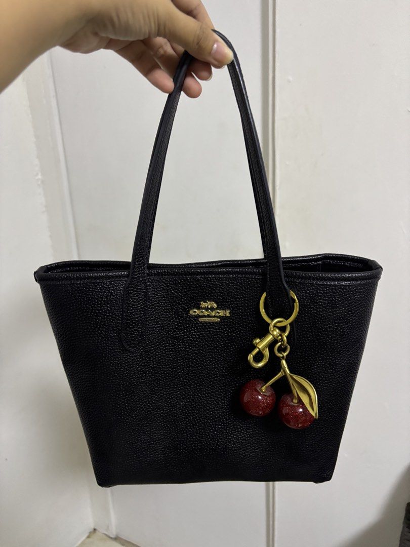 Coach Black Tote Bag with Cherry Charm (Category: Luxury Bags & Wallets) located in Pasig City. Submitted by pinkbarbiexx (Listing ID 1427455814, Image 2). Description: .