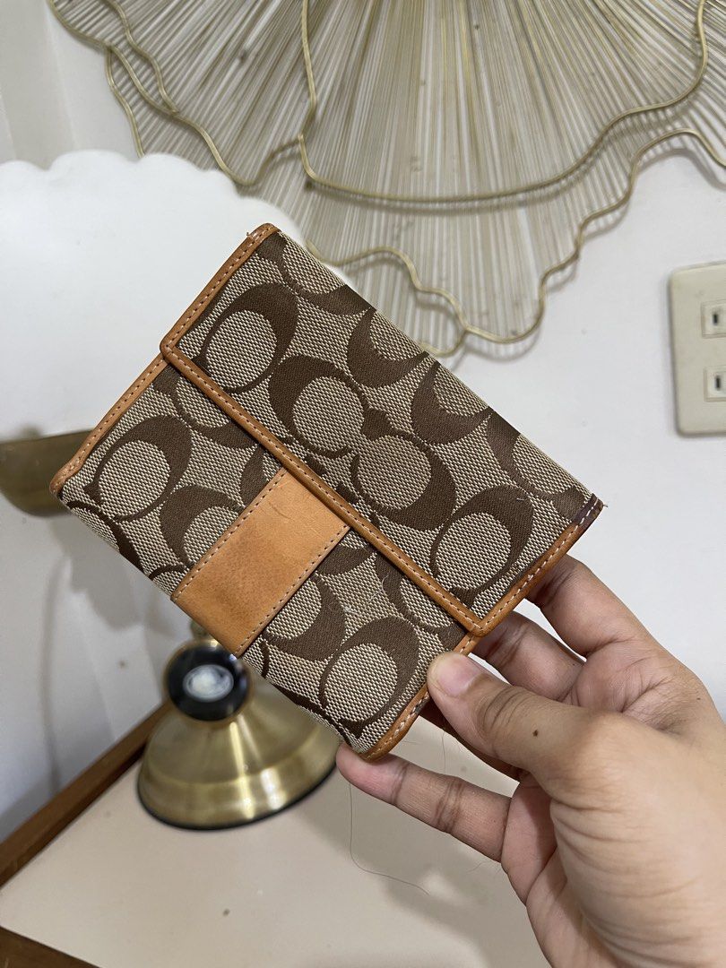 Coach Brown Signature Wallet (Category: Wallets & Card holders) located in Urdaneta. Submitted by picky_picker (Listing ID 1427357805, Image 2). Description: Preloved Coach Wallet With Multiple Card Slots Please Check All the Pictures Provided for more details.