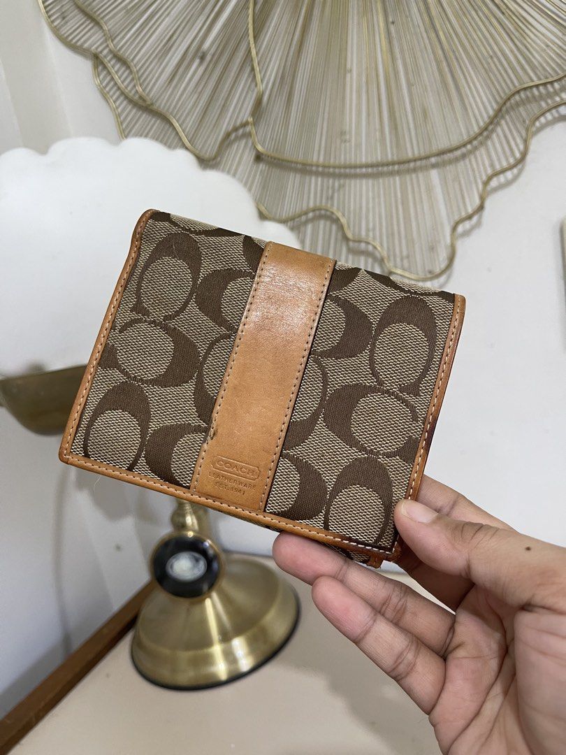Coach Brown Signature Wallet (Category: Wallets & Card holders) located in Urdaneta. Submitted by picky_picker (Listing ID 1427357805, Image 1). Description: Preloved Coach Wallet With Multiple Card Slots Please Check All the Pictures Provided for more details.