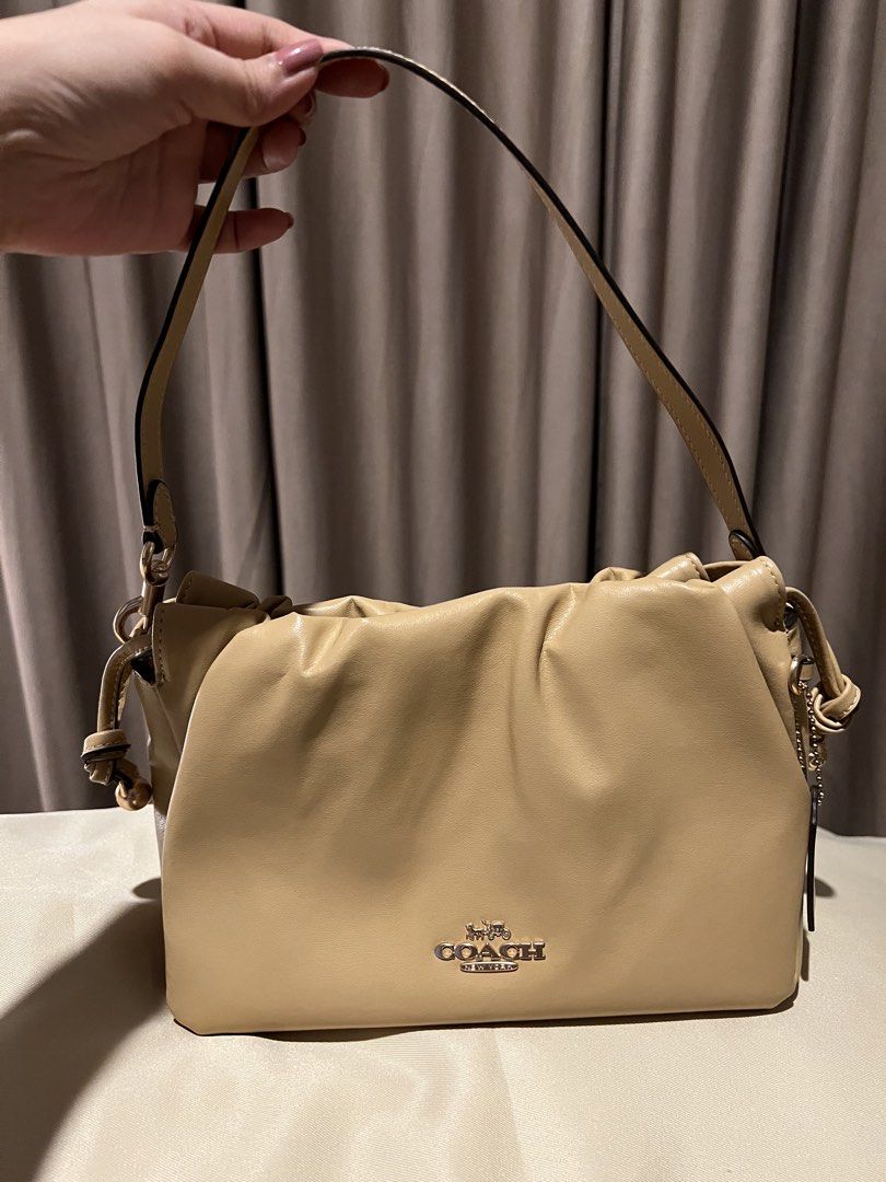 Coach cloud bag (Category: Luxury Bags & Wallets) located in Manila. Submitted by by_cpop (Listing ID 1427440574, Image 2). Description: Cutest cloud bag 🤍 can fit alot! Long wallet and short umbrella Comes with long strap PM for more pics.