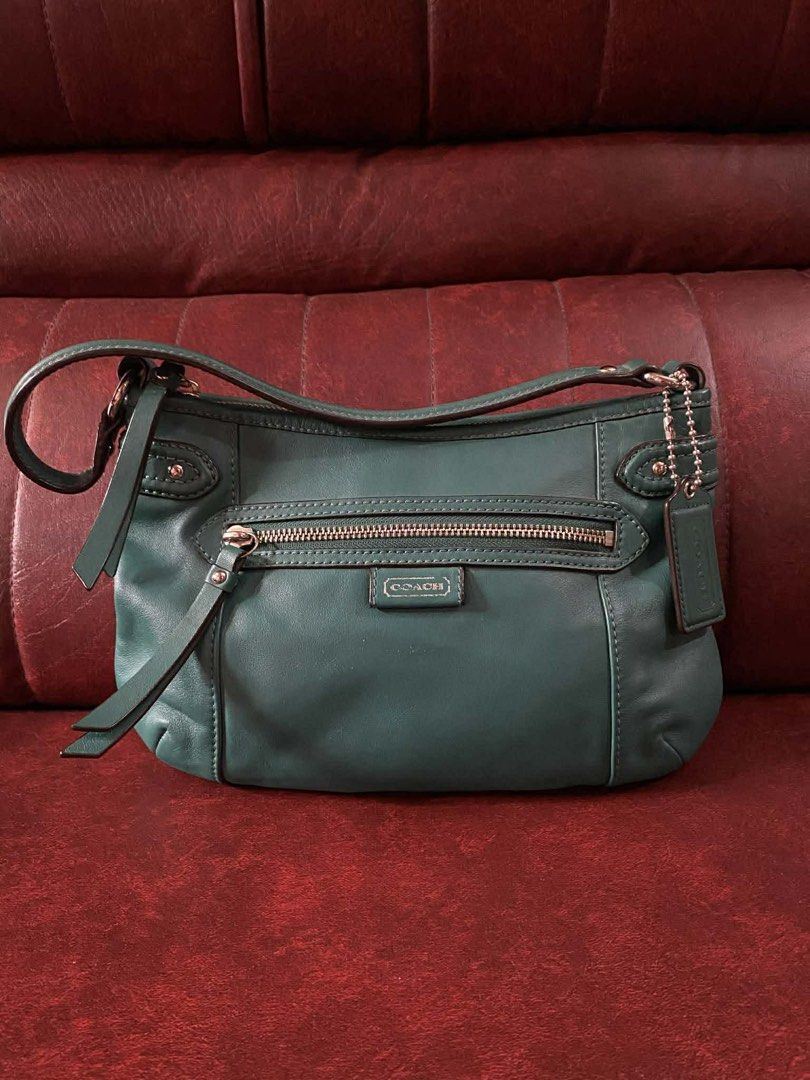 Coach Daisy spectator crossbody bag (Category: Luxury Bags & Wallets) located in Cavite. Submitted by rov26 (Listing ID 1427336665, Image 2). Description: Coach Daisy spectator crossbody bag with Adjustable and detachable strap included. Comes with original care card/guide Condition: Overall in good condition. The leather is still soft and well-maintained. There are some minor signs of wear, including small scuffs and marks on the bottom and corn