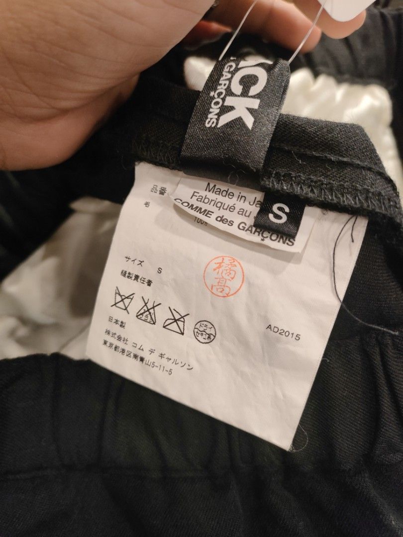 Comme des Garcons Black Wool Pants (Category: Trousers) located in Quezon City. Submitted by markythegrappler17 (Listing ID 1427392080, Image 3). Description: -Black pants from Comme des Garcons - Made in Japan - Features a buttoned cuff design -The tag indicates the pants are made of 100% wool -Size S - The garment is washed, and the texture will alter with wear and cleaning -Do not tumble dry or steam..