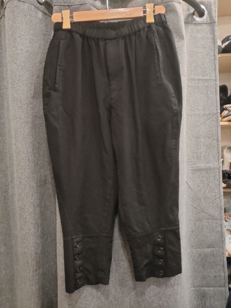 Comme des Garcons Black Wool Pants (Category: Trousers) located in Quezon City. Submitted by markythegrappler17 (Listing ID 1427392080, Image 1). Description: -Black pants from Comme des Garcons - Made in Japan - Features a buttoned cuff design -The tag indicates the pants are made of 100% wool -Size S - The garment is washed, and the texture will alter with wear and cleaning -Do not tumble dry or steam..