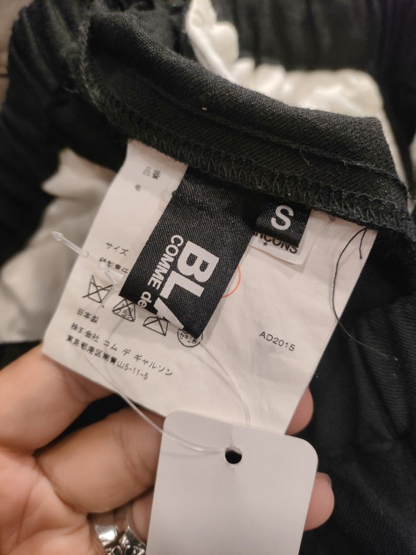 Comme des Garcons Black Wool Pants (Category: Trousers) located in Quezon City. Submitted by markythegrappler17 (Listing ID 1427392080, Image 2). Description: -Black pants from Comme des Garcons - Made in Japan - Features a buttoned cuff design -The tag indicates the pants are made of 100% wool -Size S - The garment is washed, and the texture will alter with wear and cleaning -Do not tumble dry or steam..