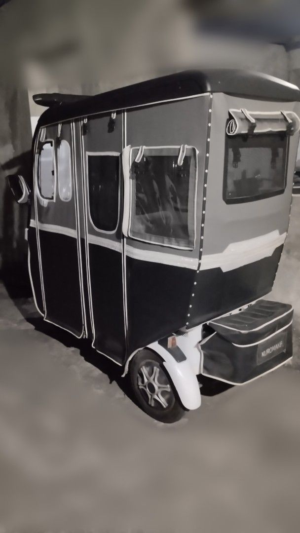Electric Tricycle with Enclosed Cabin (Category: Motorbikes for Sale) located in Dasmarinas. Submitted by ofelia1220 (Listing ID 1427429498, Image 2). Description: EBIKE KUROMAKE 3 WHEELS FOR SALE EXCELLENT CONDITION NO ISSUES RAIN PROOF RUNNING SMOOTH WITH COMPARTMENT WITH BLUETOOTH SPEAKER MAKUNAT YUNG BATTERY MATAGAL MALOWBAT LADY OWNED KAYA HINDI LASPAG 60V/20AH Before 800 watts Upgrade to 1,500 watts All lights working Wiper Working Conditio