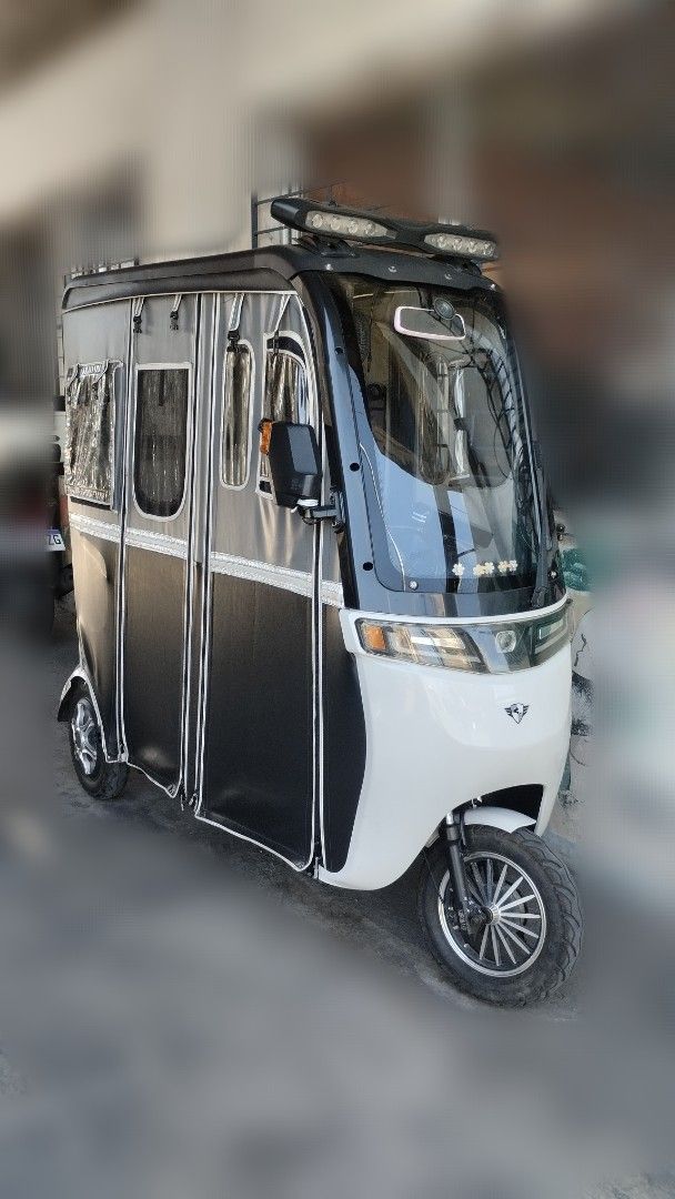 Electric Tricycle with Enclosed Cabin (Category: Motorbikes for Sale) located in Dasmarinas. Submitted by ofelia1220 (Listing ID 1427429498, Image 1). Description: EBIKE KUROMAKE 3 WHEELS FOR SALE EXCELLENT CONDITION NO ISSUES RAIN PROOF RUNNING SMOOTH WITH COMPARTMENT WITH BLUETOOTH SPEAKER MAKUNAT YUNG BATTERY MATAGAL MALOWBAT LADY OWNED KAYA HINDI LASPAG 60V/20AH Before 800 watts Upgrade to 1,500 watts All lights working Wiper Working Conditio