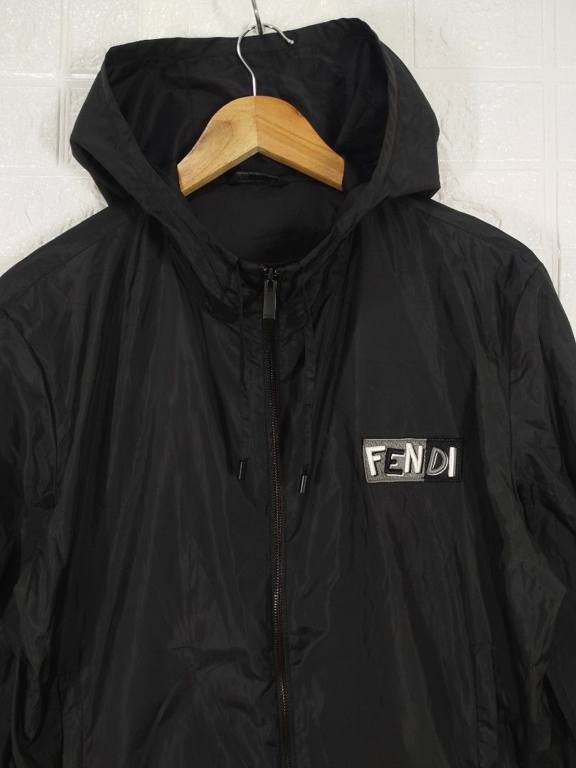 Fendi Black Hooded Jacket (Category: Luxury Apparel) located in Baguio. Submitted by dansteals (Listing ID 1427477552, Image 2). Description: Black Fendi hooded jacket. Features a front zipper closure and the Fendi logo on the chest. The jacket has a hood and a size tag indicating size 46. Made in Italy. The zipper pull also has the Fendi logo. 26 x 22 LARGE.
