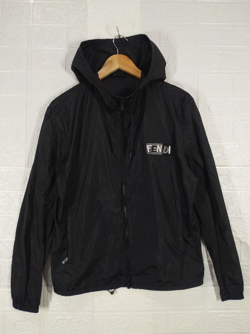 Fendi Black Hooded Jacket (Category: Luxury Apparel) located in Baguio. Submitted by dansteals (Listing ID 1427477552, Image 1). Description: Black Fendi hooded jacket. Features a front zipper closure and the Fendi logo on the chest. The jacket has a hood and a size tag indicating size 46. Made in Italy. The zipper pull also has the Fendi logo. 26 x 22 LARGE.